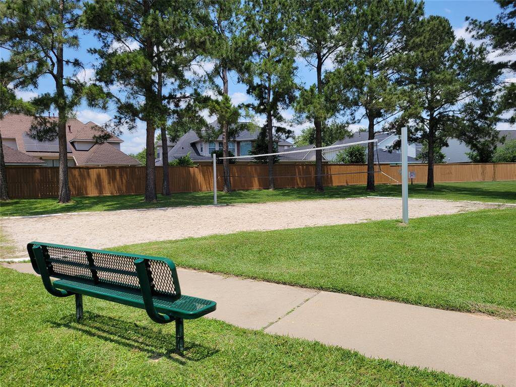 Volley-ball area. Also has green belt with walking & jogging trails.