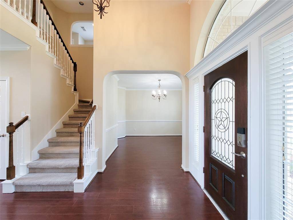 Foyer with two story tall ceiling & extended entry. Freshly painted interior/exterior, new carpet (2025) & so much more.