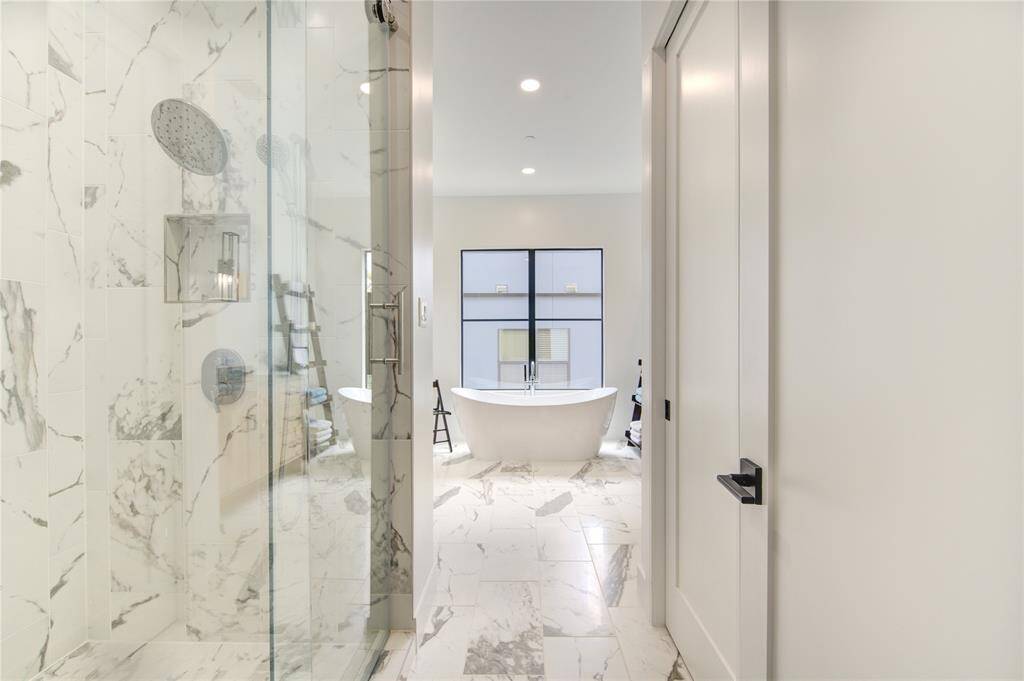 This spa-inspired Owner's Ensuite is a perfect escape from a long day at work.  Luxury presence at its finest - time to be spoiled!