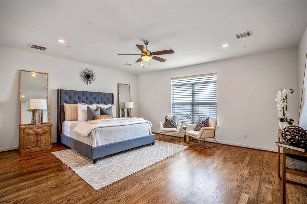 The expansive primary suite is located on the third floor and boasts hardwood floors, recessed lighting, abundant natural lighting  & an ensuite primary bath.