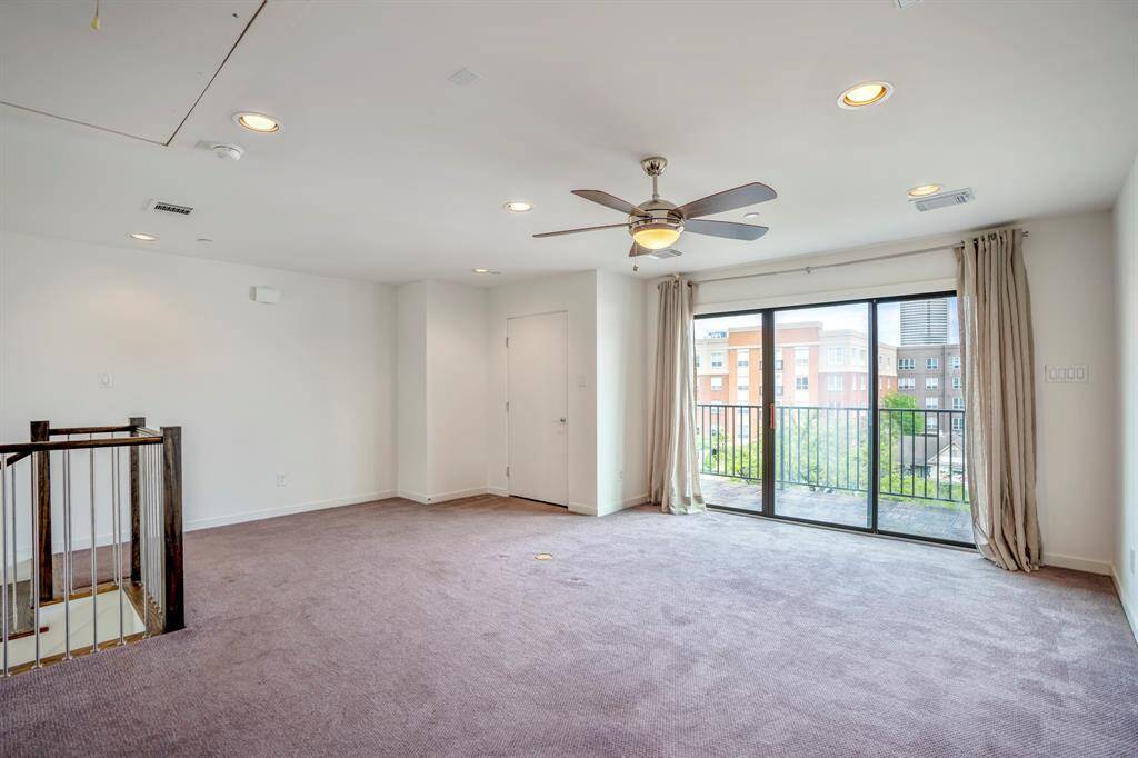 On the 4th floor you will find a large game room, a third bedroom, full bath and sliding doors that lead to the balcony.