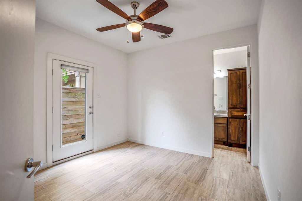On the first floor, you will find a secondary bedroom with porcelain tile flooring throughout, a private entrance to the side yard and an ensuite bath.