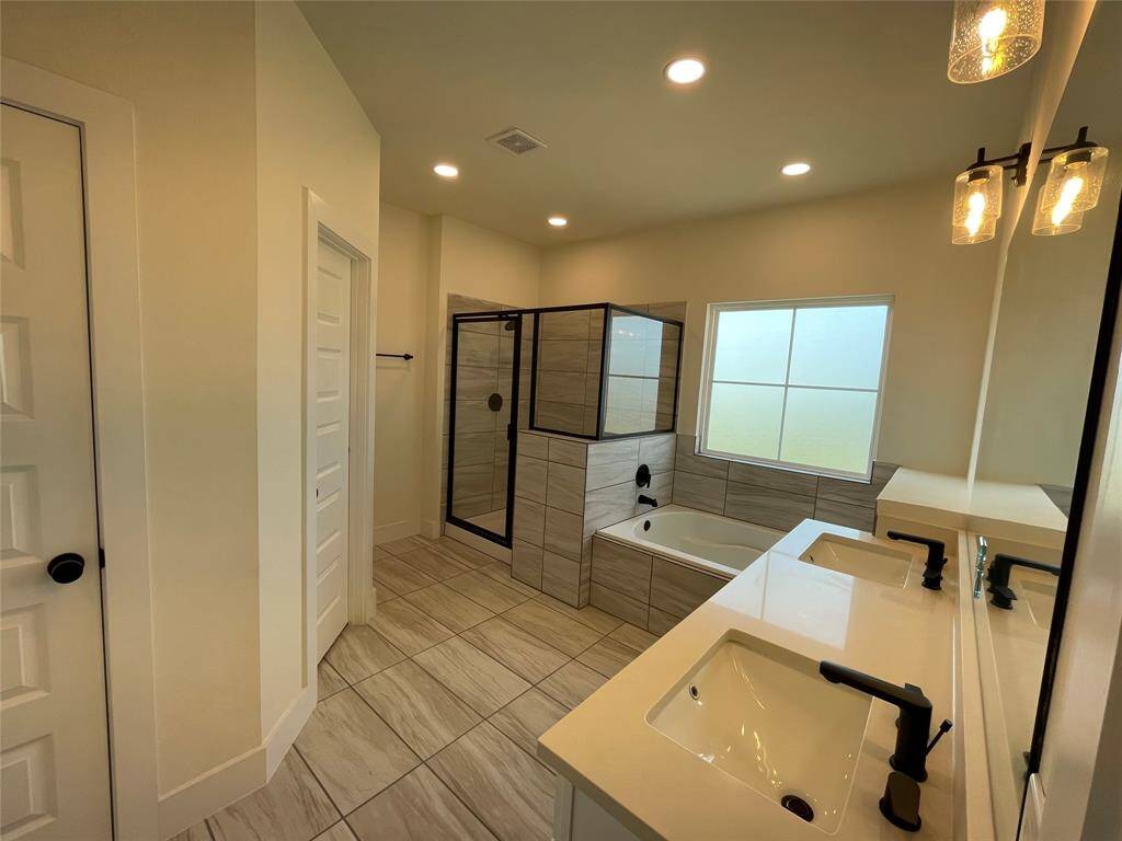 Extra Special Primary Bath with Standing Shower and Grand Soaking Tub.