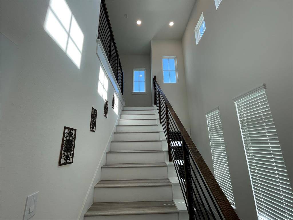 Lots of Windows for natural light and staircase leading to second floor.