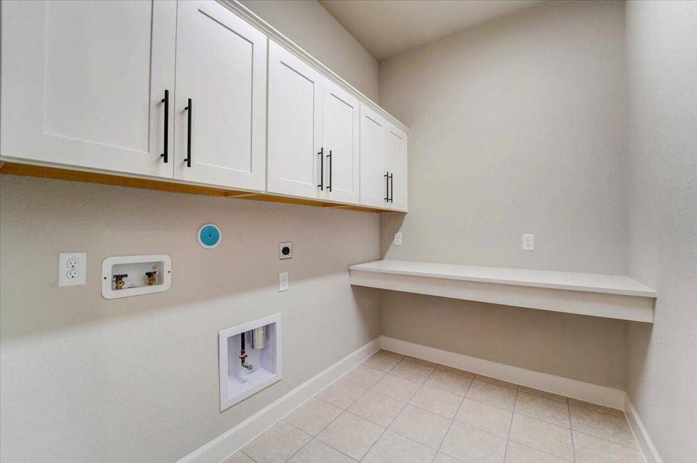 EXAMPLE PHOTO: Big utility room with folding table. Plumbed for gas and electric