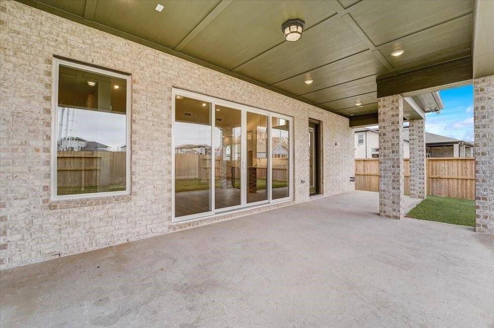 EXAMPLE PHOTO: Huge outdoor living area provides a great place to grill your favorites!