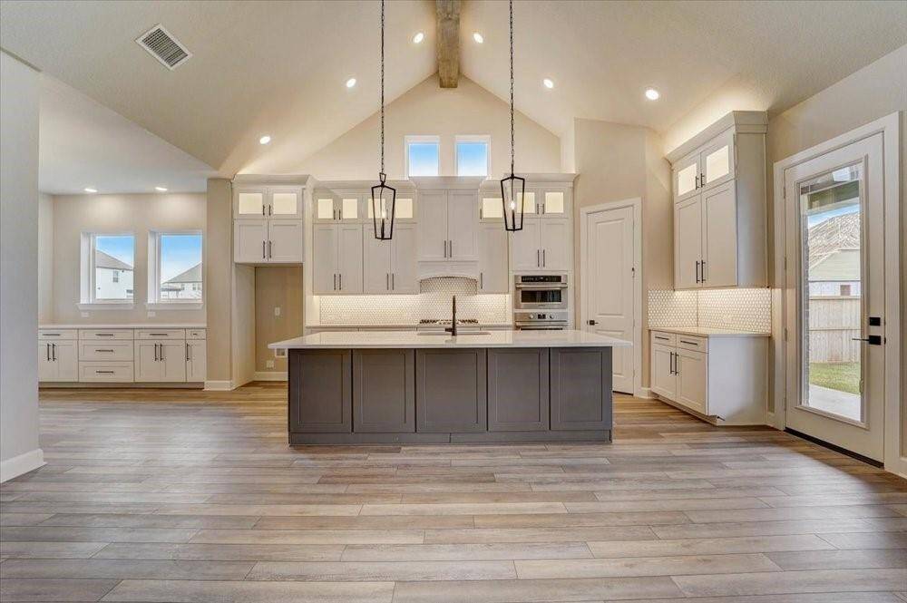 EXAMPLE PHOTO: Dramatic cathedral ceiling will impress everyone! And provides lots of light in this gorgeous Kitchen!