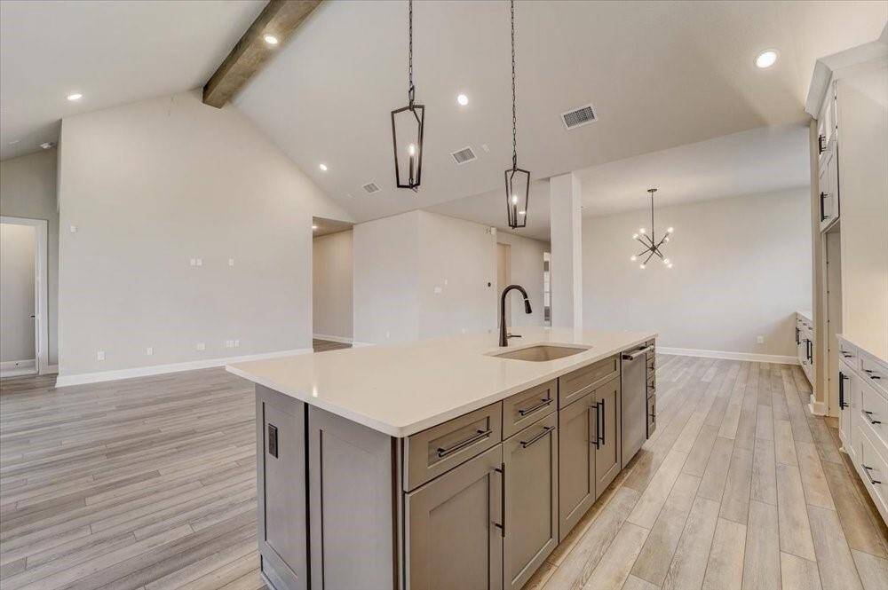 EXAMPLE PHOTO: Large island/breakfast bar is great for people hanging out in the Kitchen!