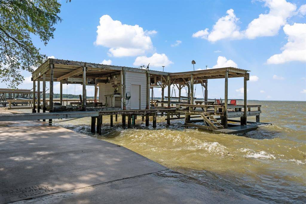 Private boat and jet ski storage with motorized private launch.  Swim deck, fishing deck and storage room.