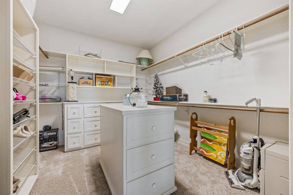 First Primary Bedroom walk-in closet.
