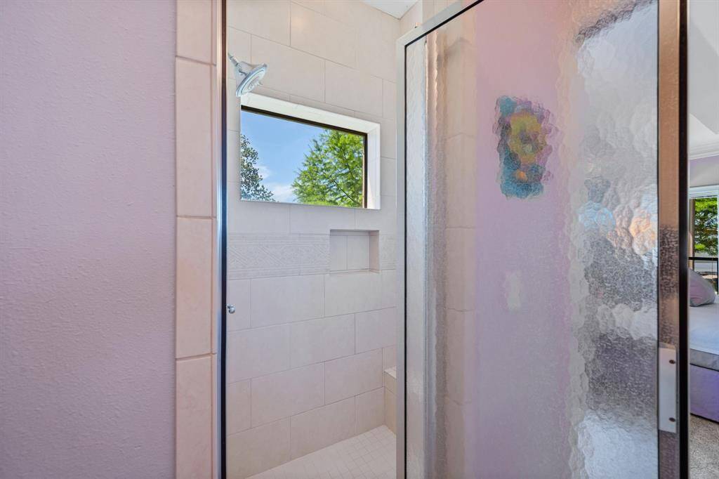 Separate tub and shower space.