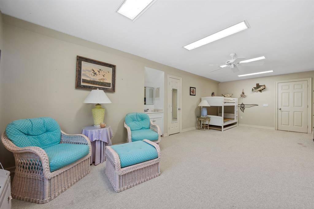 Upstairs over garage is a large flex space with 1/2 bath.