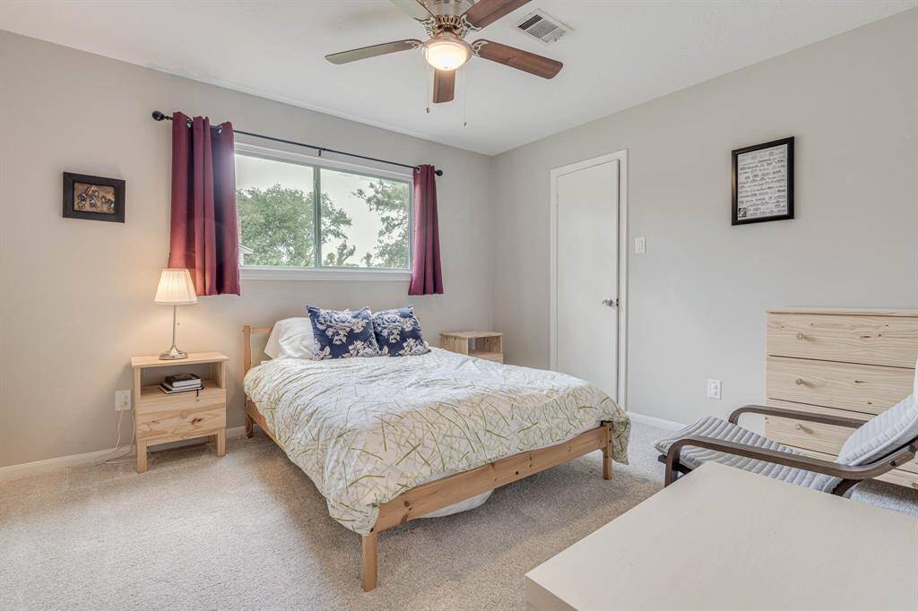 Upstairs secondary bedrooms offer comfort and privacy—perfect for family, guests.