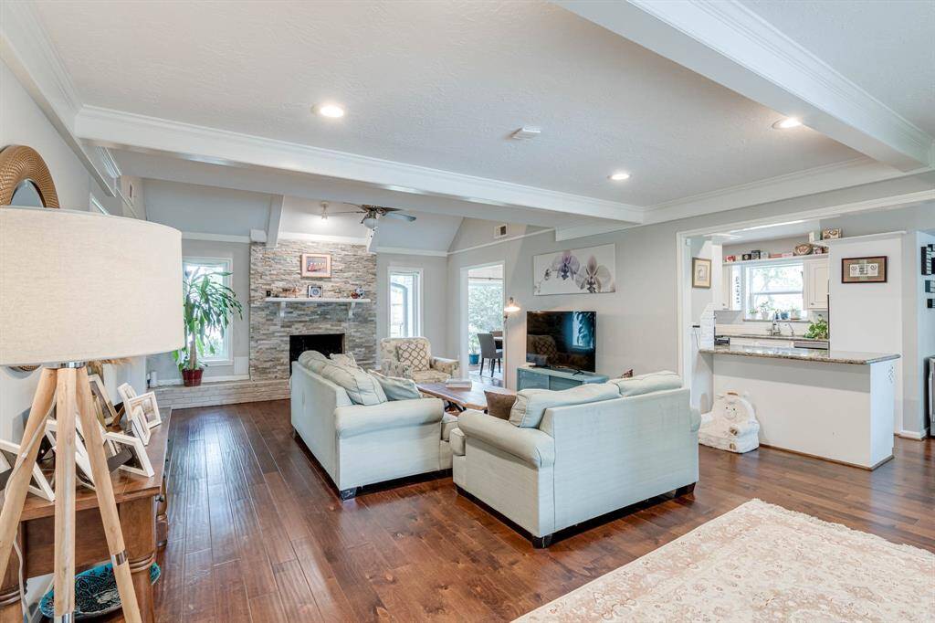 Spacious living room with expansive picture windows that flood the space with natural light—perfect for both relaxing and entertaining