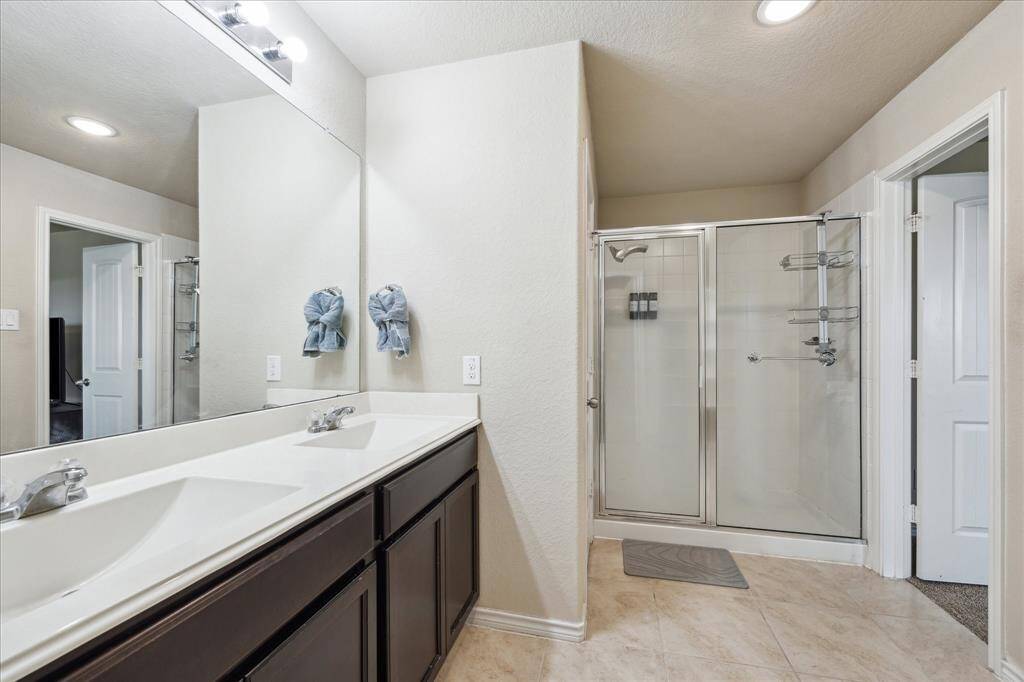 Shower and linen closet  in master bathroom