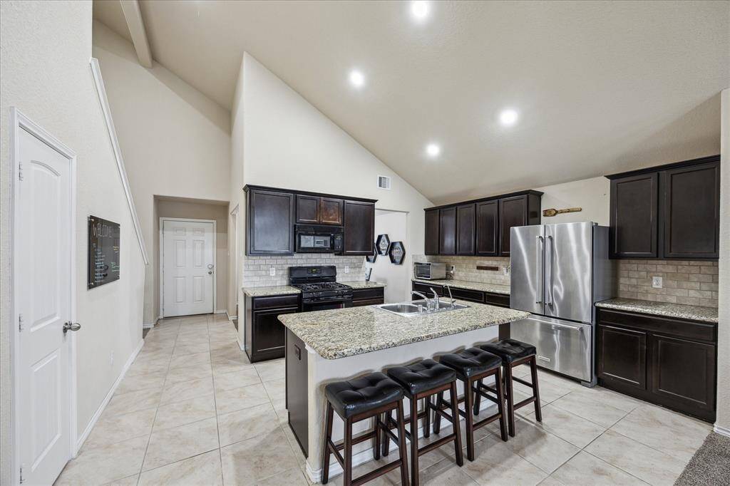 Large island kitchen opens to the living room