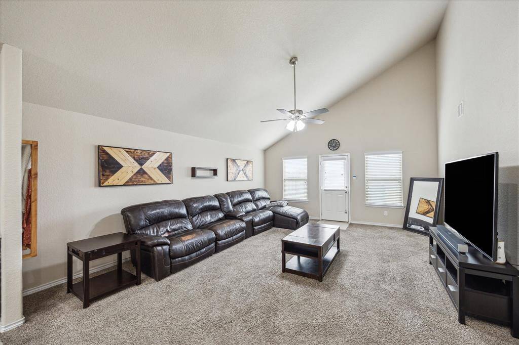 Living room with tall ceiling, so airy, light and bright