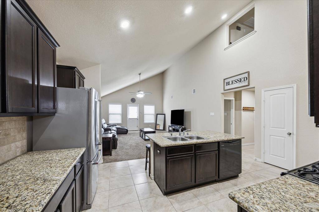 Another view of kitchen and living room
