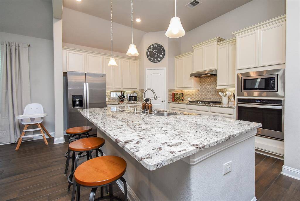 Built in microwave and electric oven. Walk in pantry is the door in the photo.