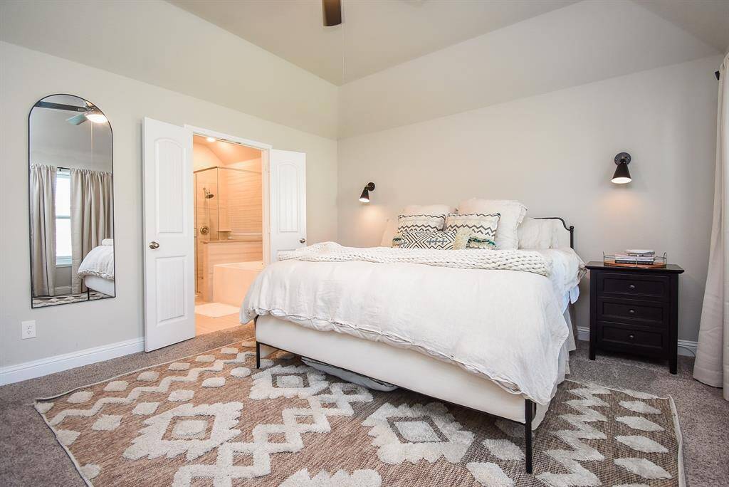 Double doors take you into the primary bath area.