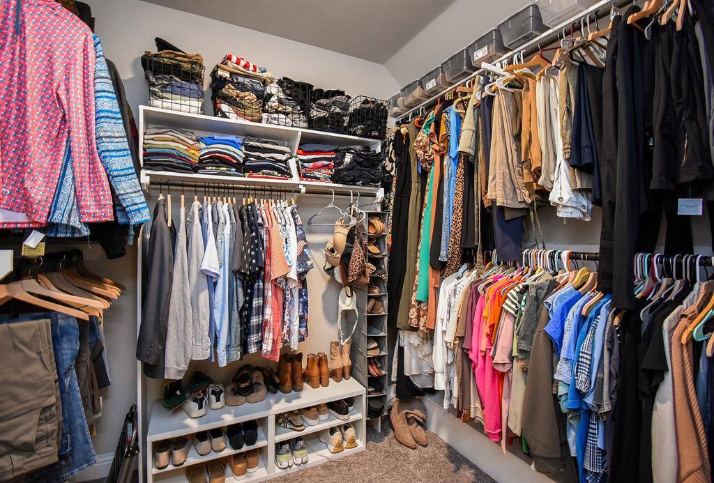 Spacious primary closet.