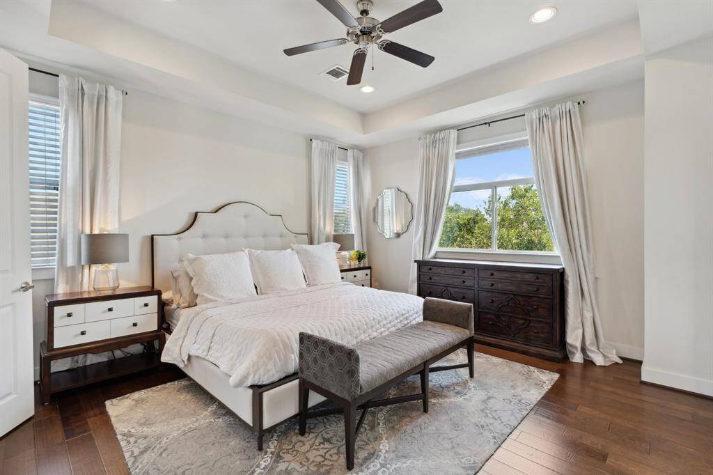 Lots of light in this spacious primary suite with views of nature. Private green space. Raised ceiling, ceiling fan, beautiful hardwoods.
