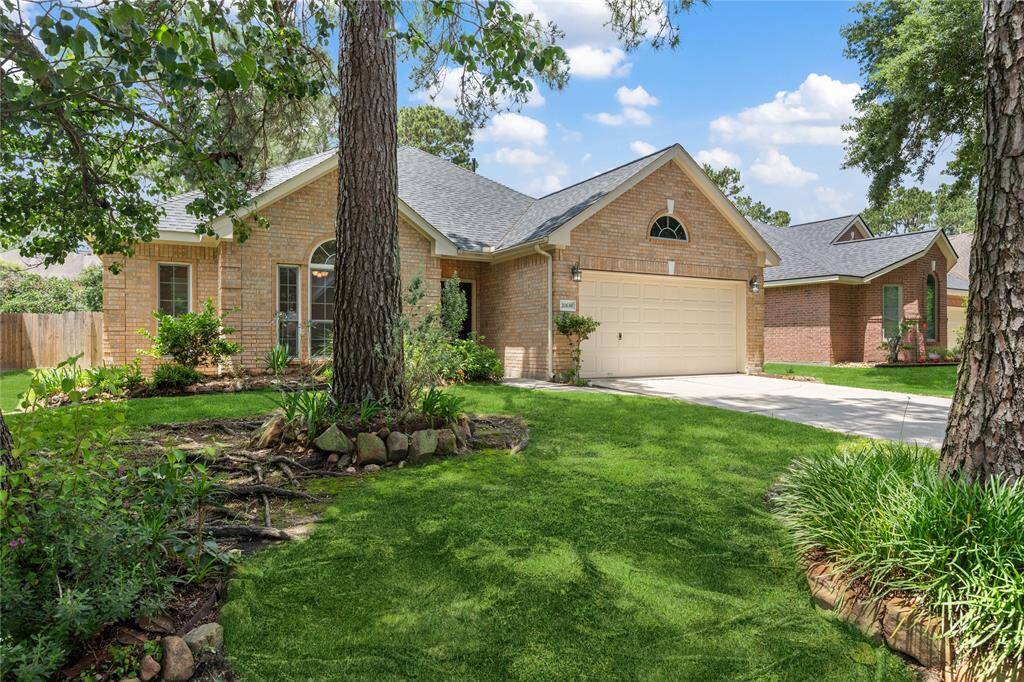 Charming single-story brick home with a well-maintained front yard, mature trees, and a two-car garage. The arched windows and landscaped garden add to its curb appeal. Perfect for a serene residential setting.