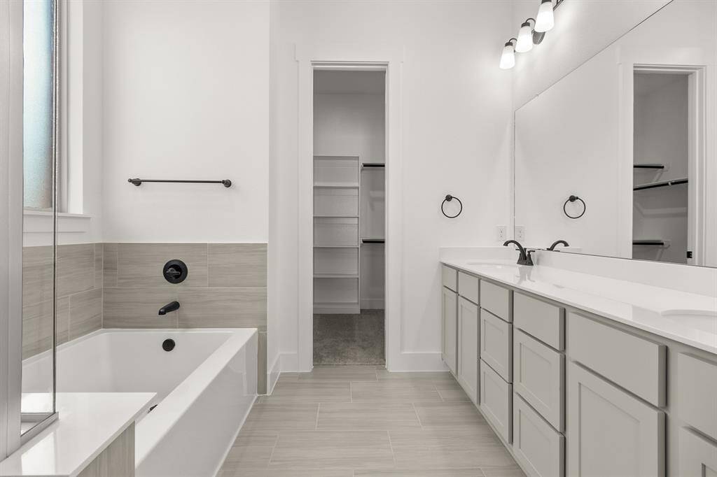 The elegant finishes, from the dazzling floors to the chic light fixtures, reflect a careful attention to detail that feels both luxurious and comforting.