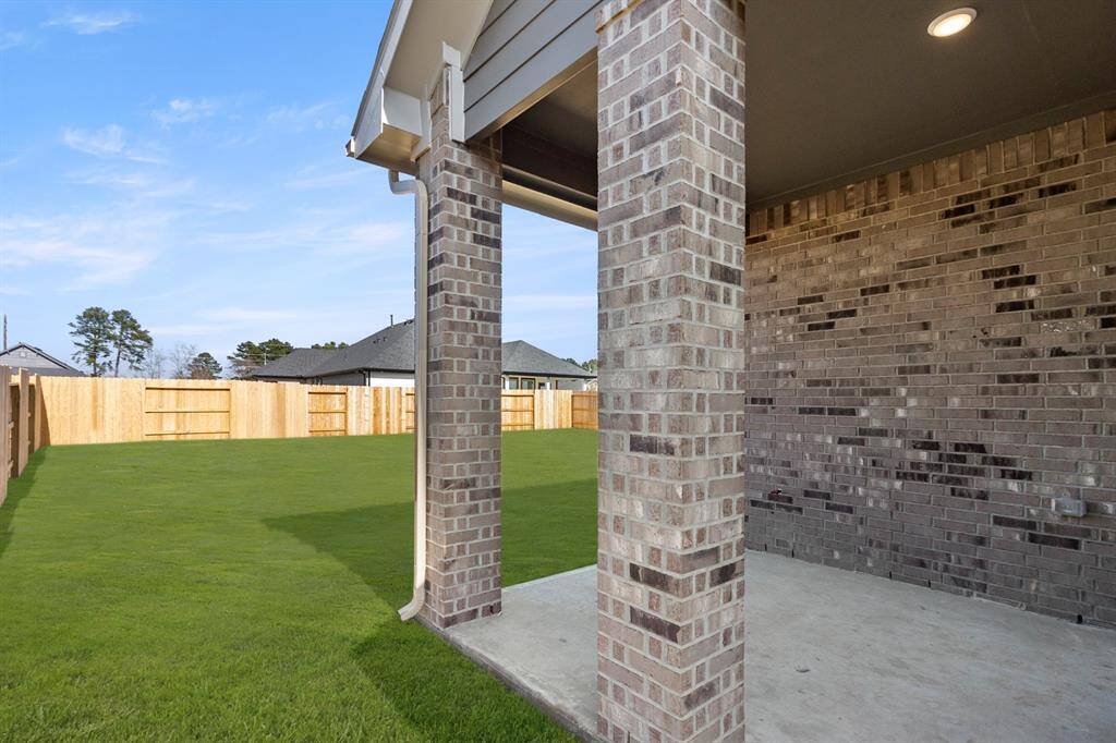 Picture a spacious patio, perfect for summer barbecues and lazy Sunday brunches with friends.