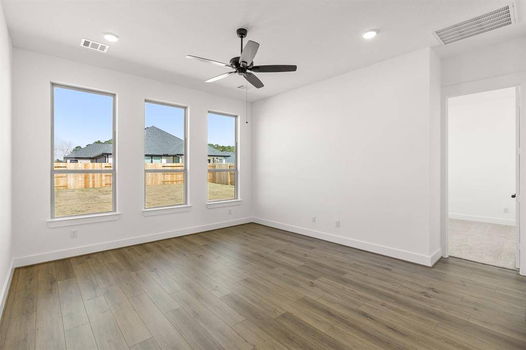 Picture expansive windows that invite natural light to dance through spacious living areas, creating a welcoming atmosphere perfect for gatherings or quiet moments of reflection.