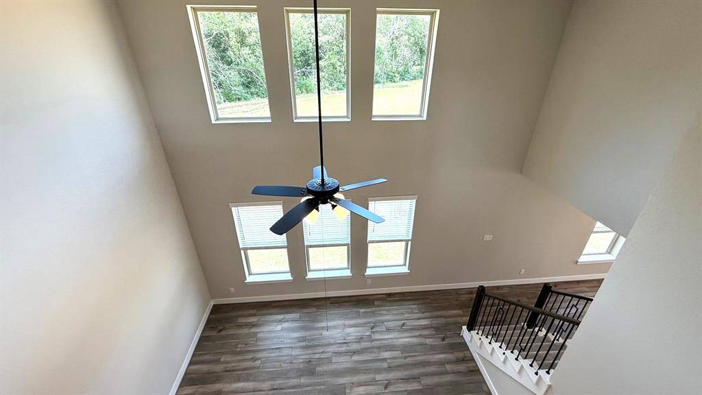 Imagine walking into a home that feels as expansive as it is inviting, bathed in natural light and framed by soaring ceilings that make every moment feel grand.
