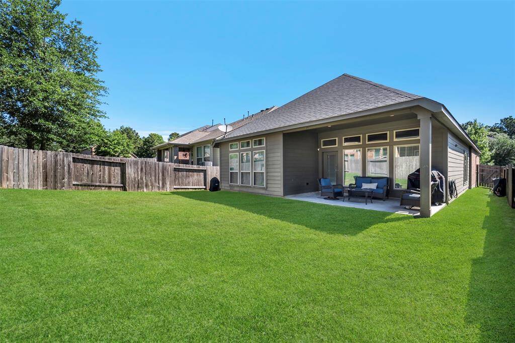 Covered back patio is great for outdoor BBQ's