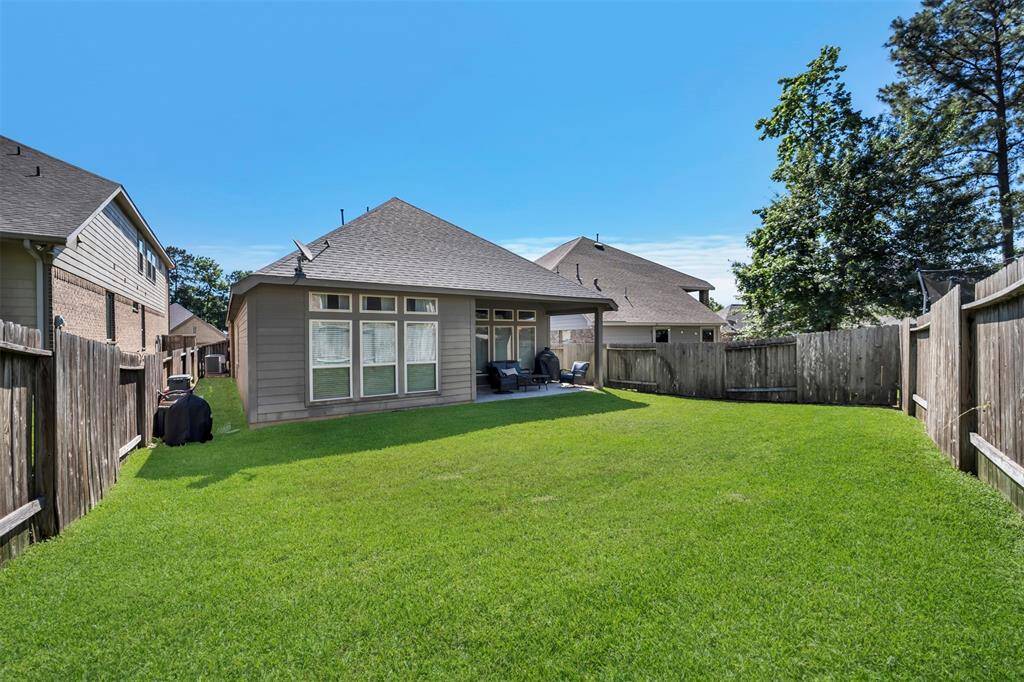Covered back patio is great for outdoor BBQ's