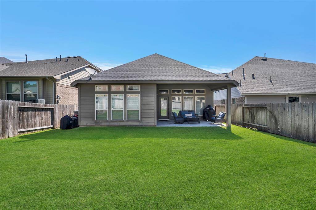 Covered back patio is great for outdoor BBQ's