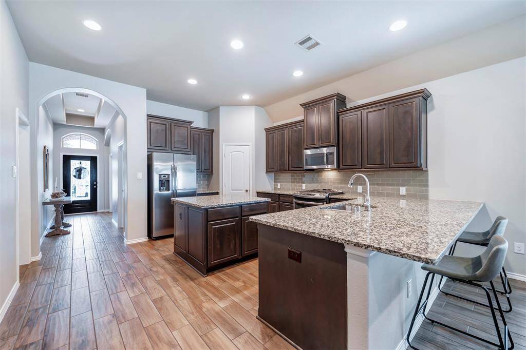 Kitchen has plenty of cabinets & countertop space including island