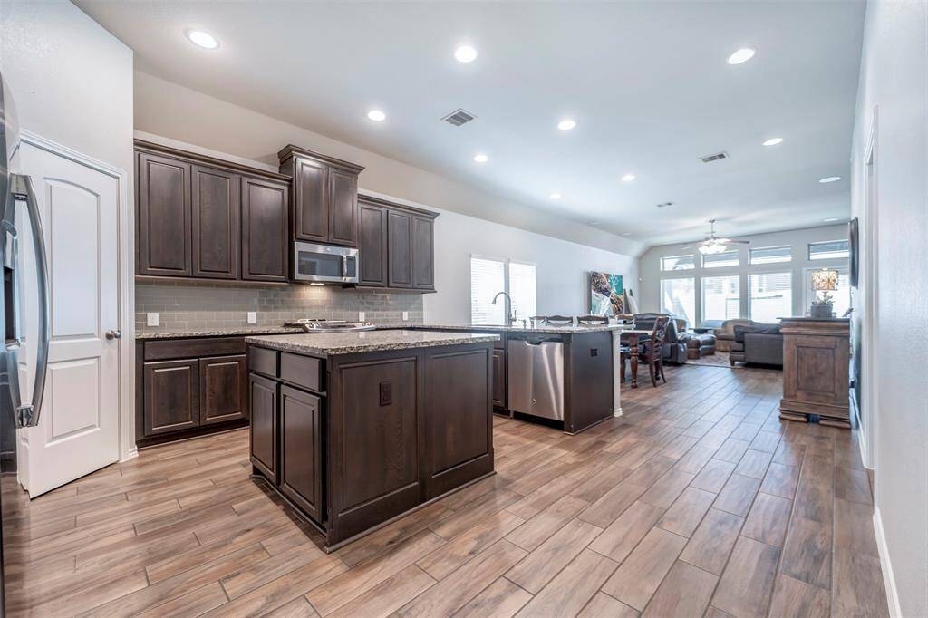 Kitchen has plenty of cabinets & countertop space including island