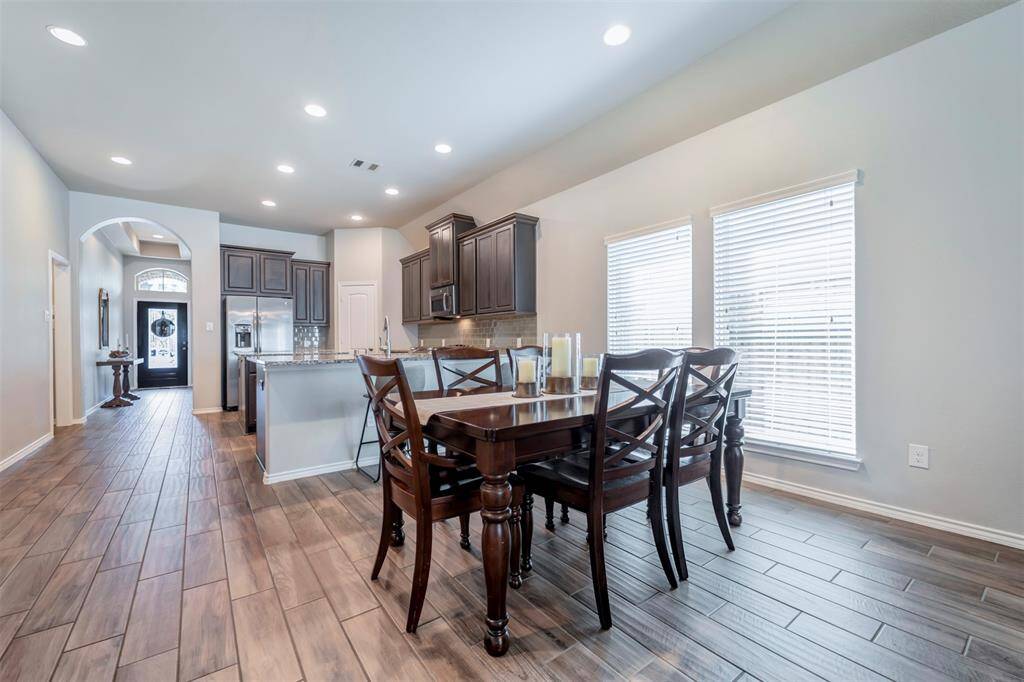 Dining area is adjacent to kitchen & open family room