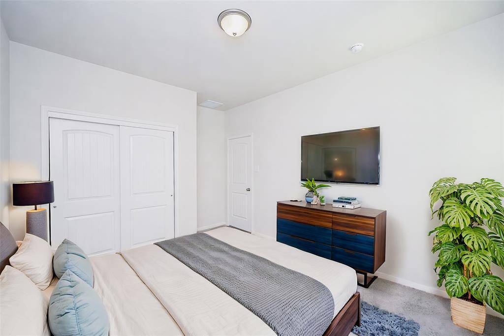 Another lush secondary bedroom suits family and staying guests.
