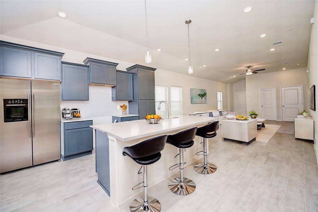This awesome floor plan easily blends social mingling from living to kitchen areas, and back again!