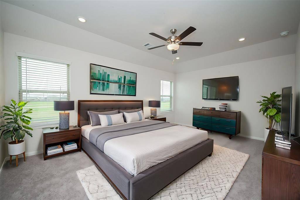 Discover this spacious primary bedroom.