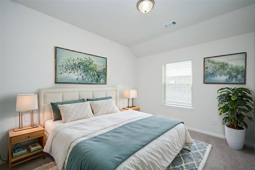 A secondary carpeted bedroom offers easy options, up and down!