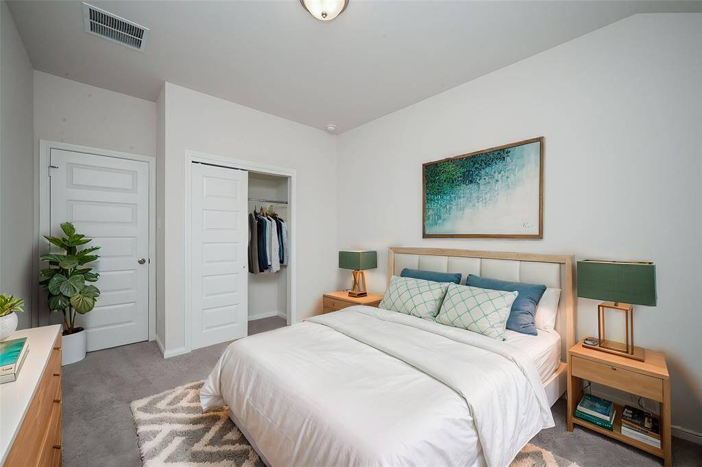 This well-proportioned bedroom offers ample space for rest and relaxation.