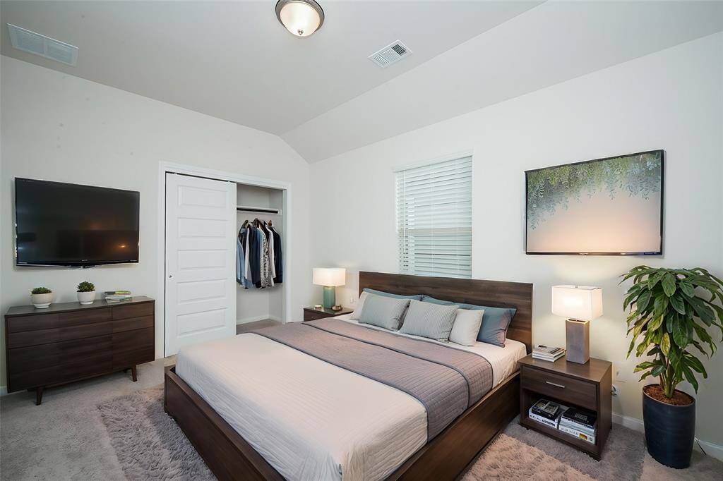 The sliding closet door offers easy access to your personal needs.