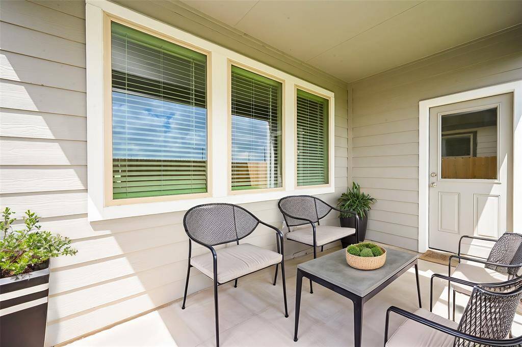 Step out to this fully covered patio, perfect for gatherings.