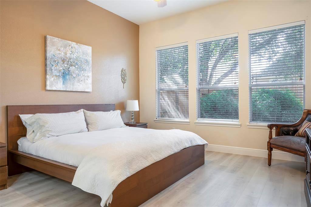 Ample natural light streams through three windows.