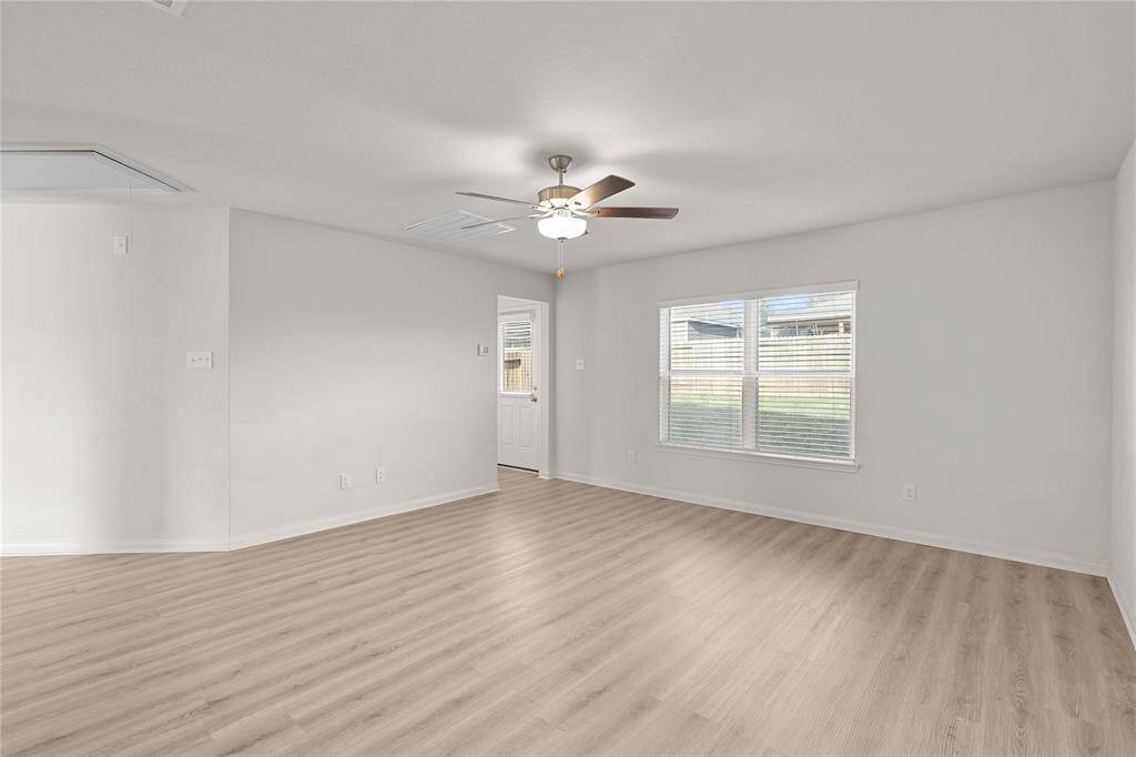 Primary suite conveniently located off the living room, perfect for relaxation. Enjoy setting up your entertainment area with a TV mount and soak in the beautiful backyard views.