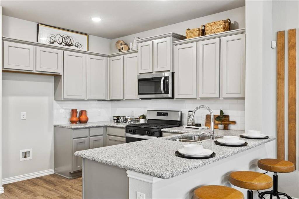 Representative photo of the Crockett floorplan by History Maker Homes, living room area, approximate completion date is June 2025