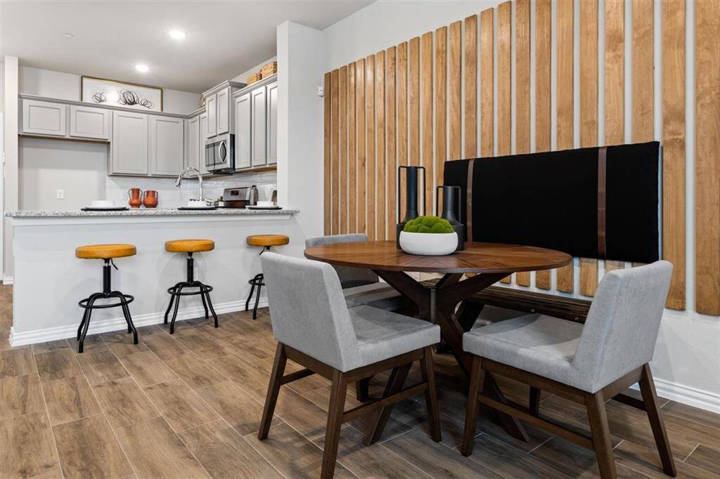Representative photo of the Crockett floorplan by History Maker Homes kitchen, approximate completion date is June 2025