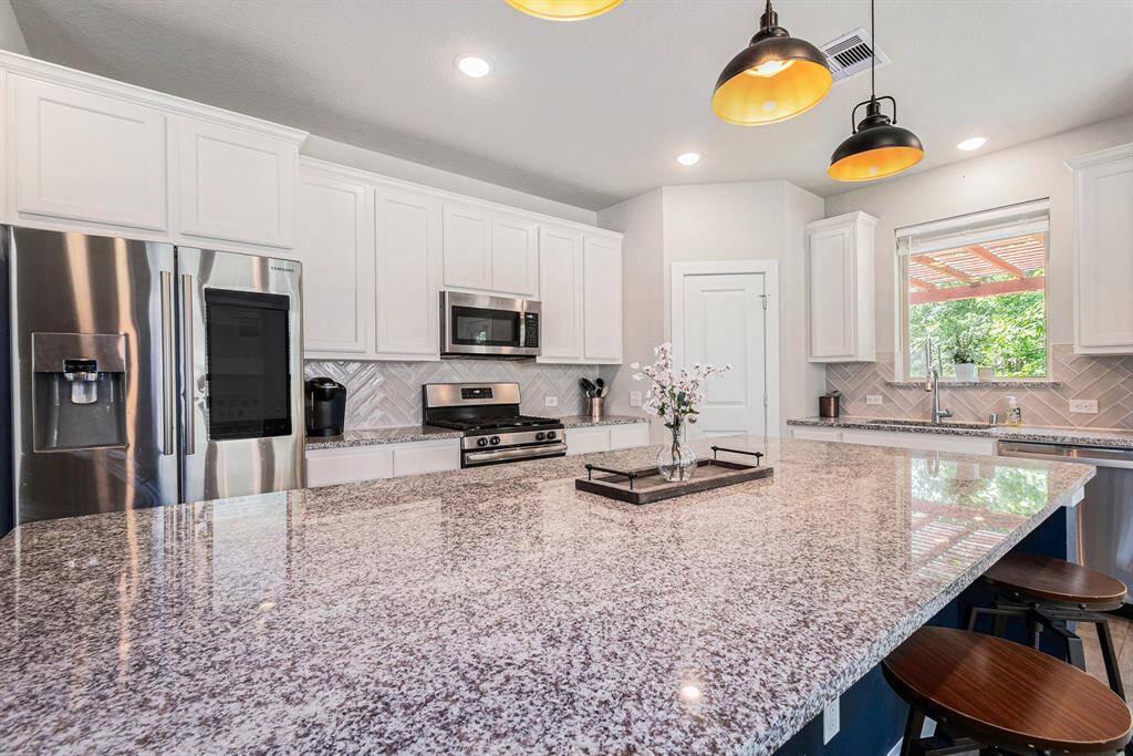 Plenty of space to gather everyone around...truly the heart of the home.