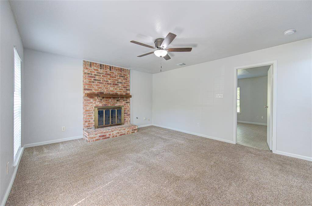 Downstairs Living Area Located Outside Primary Bedroom